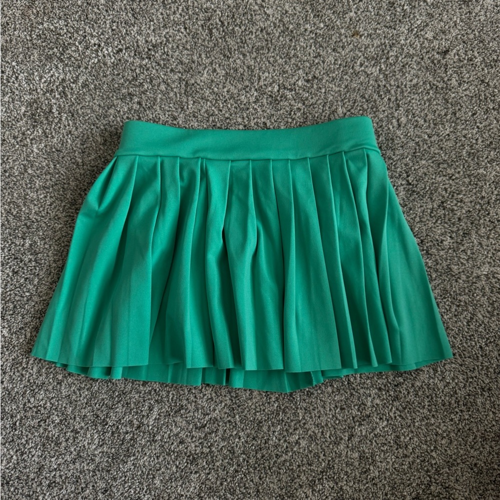 Green mini tennis skirt